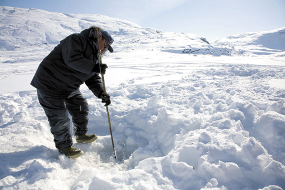 This man ice fishes near Pangnirtung, one of among 12 communities around the world that are involved in a global project on traditional indigenous foods. (PHOTO COURTESY OF KP STUDIOS AND HARRIET KUHNLEIN)