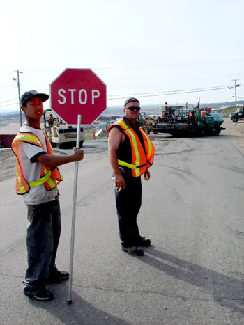 A road paver’s dream: last weekend’s dry heat in Iqaluit was perfect for the city’s road paving team, who managed to  lay asphalt on most roads in the Happy Valley section of town. (PHOTO BY JANE GEORGE)