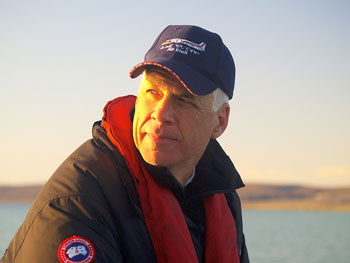 Dugald Wells, the president and chief executive of Cruise North Expeditions, scans the scenery during an early morning zodiac ride in Creswell Bay, Somerset Island Sept. 3. Despite a rocky economy, Wells said his company has seen its bookings remain steady this summer. (PHOTO BY CHRIS WINDEYER)