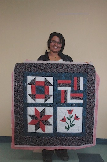 Maali Tukirqi shows off her work in progress.
