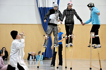 Stilt walkers in training at a workshop in Quaqtaq. (PHOTO BY PHILIPPE CHIASSON)