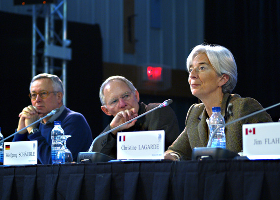 Giulio Tremonti, Italy's Minister of Economy and Finance, left, and German finance minister, centre, listen as French finance minister Christine Lagarde speaks to the closing press conference of the G7 finance ministers meeting at the Cadet Hall in Iqaluit Feb. 6. (PHOTOS BY CHRIS WINDEYER)