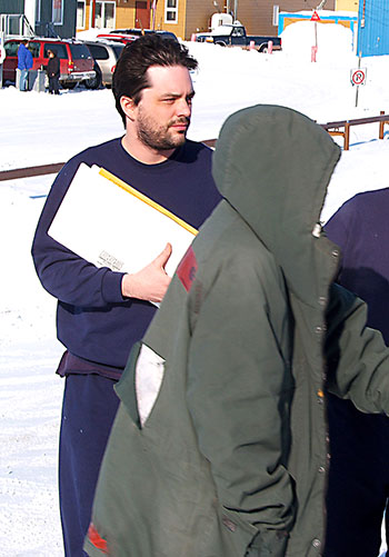 Nathan Evans stands in front of the Iqaluit courthouse building after a court appearance in 2008. The former Iqaluit resident, who worked for Qikiqtaaluk Information Technology Corp., will serve three more months in jail on convictions of possessing child pornography and sexual assault. (FILE PHOTO)