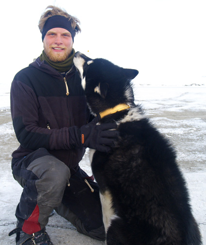 Jakob Nilesen, a member of the Sirius patrol team, gets some affection from one of the members of his dog team. The teams patrol a massive swath of Northern Greenland and are out on the land for as long as three months at a time. (PHOTO BY CHRIS WINDEYER)