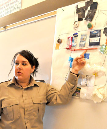This display of trash picked up around Kugluktuk offers Charlene Beanish, the Kitikmeot’s environmental protection officer, a chance to tell young students about the “three R’s” of energy conservation— that is, to reduce, reuse and recycle. (PHOTO BY VANESSA MOSEK)