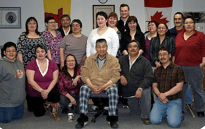 The Kitikmeot Inuit Association staff members are  mourning the loss of the organization’s long-time executive director, Fred Elias— shown here sitting in the middle of the front row with the KIA staff— who died July 17 of cancer. (PHOTO COURTESY OF THE KIA)