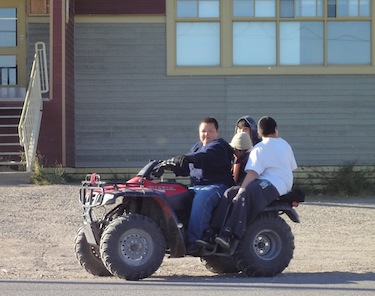 You don’t have to look hard to see young drivers and passenger-packed all-terrain vehicles on Kuujjuaq roads. (PHOTO BY JANE GEORGE)