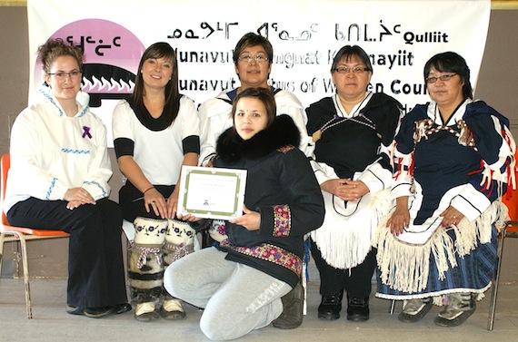 Kandace Kusugak, winner of the first “Outstanding Female Youth Award” from the Qulliit Nunavut status of women council, sits with council members Maude Bertrand, Trista Mercer (vice-president), Donna Adams (president), Martha Aupaluktuq-Hickes (vice-president) and Annie Iqalukjuak. Qulliit council members presented the award to Kusugak last week at their meeting in Rankin Inlet. (PHOTO BY T. SAMMURTOK)