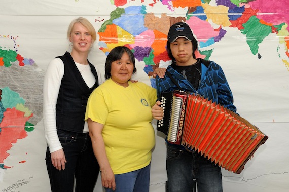 Teachers Carrie Powers, left and Rosie Etok, centre, who work at Ulluriaq School in Kangiqsualujjuaq were surprised to discover that 15-year-old Elijah Annanack, a student with learning disabilites, could play the accordion. Now, the three are travelling to Germany to visit the Hohner factory that makes accordions. (PHOTO BY PASCAL POULIN)