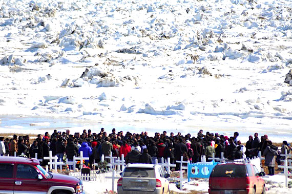 Mourners gather at the cemetery in Iqaluit May 26 to say goodbye to Johnny Nowdlak, a respected hunter and wildlife officer. Nowdlak was killed May 23 when his snowmobile collided with another snowmobile on Frobisher Bay outside of Iqaluit. The driver of the second snowmobile is in critical condition in an Ottawa hospital. (PHOTO BY SARAH ROGERS)