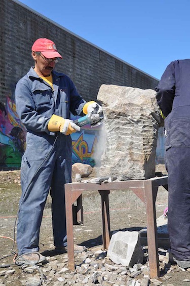 Repulse Bay carver Paul Maliki is one of six master carvers working in front of Iqaluit city hall this week as part of the Nunavut Arts Festival. Maliki and his fellow carvers’ work will be auctioned off at a festival dinner July 2. (PHOTO BY SARAH ROGERS)