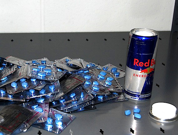This week at house 1690-B in Iqaluit, RCMP seized a rifle and ammunition, a money counter, drug paraphernalia, and 761 pills, shown here, which are believed to be counterfeit Viagra tablets. Two men from Quebec, who had been visiting that residence, were arrested later on July 13 when their flight from Iqaluit arrived at Montreal's Trudeau airport. (PHOTO/ RCMP)