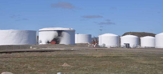 Crews were cleaning out tank 14 at Iqaluit’s fuel tank farm July 2 when a fire broke out, forcing works and emergency crews to evacuate the area. The fire was later extinguished and the city’s fire department is investigating the incident. (PHOTO BY SARAH ROGERS)