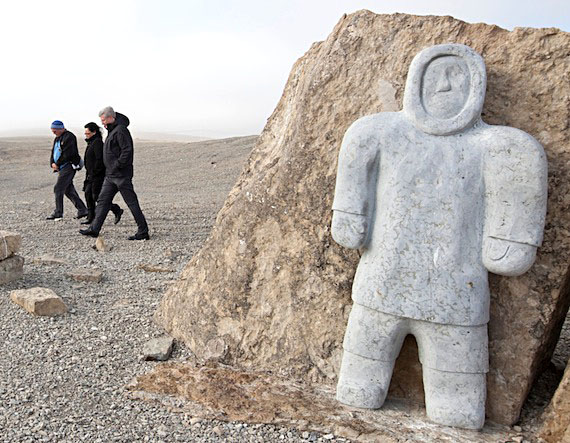 Prime Minister Stephen Harper, Nunavut MP Leona Aglukkaq and Senator Dennis Patterson, during their Aug. 23 visit to Resolute Bay, visit the monument erected in Resolute Bay to honour the High Arctic relocatees. (PHOTO BY DEB RANSOM,PMO)
