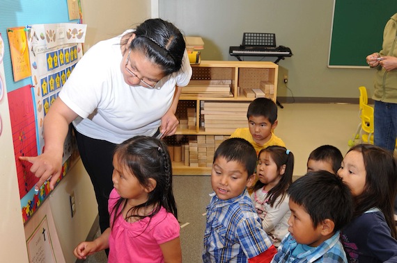 Ina Baron, kindergarten teacher at Kangiqsualujjuaq's Ulluriaq School, introduces her new students to school on Aug. 29. (PHOTO BY PASCAL POULIN)