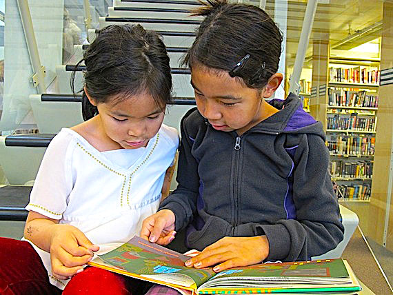 During Literacy Week in Nunavut, Sept. 25 to Oct. 1, the May Hakongak library in Cambridge Bay is hosting events to encourage young — like these two girls, Jewel (left) and Tiana (right) Maksagak — and old to read. On Sept. 28, the Nunavut Literacy Council is encouraging people to read for at least 15 minutes. Nunavut wants to challenge the Northwest Territories, which won the territorial 