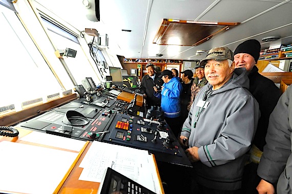 Elder Norman Snowball pretends to take his turn at the wheel of the Clipper Adventurer when the ship docked Sept. 21 in Kangiqsualujjuaq. (PHOTO BY PASCAL POULIN)