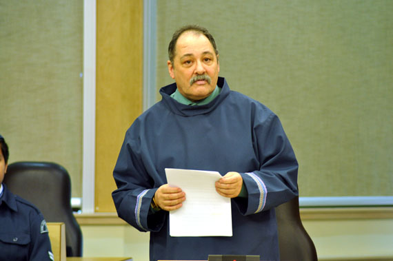 Joe Enook, the new MLA for Tununiq, signs documents that mark his swearing-in as a new MLA. Enook, as well as Pangnirtung's Hezakiah Oshutapik, and Iqaluit West's Monica Ell, were sworn in as MLAs in Iqaluit Sept. 22 after winning by-elections earlier this month. (PHOTO BY CHRIS WINDEYER)