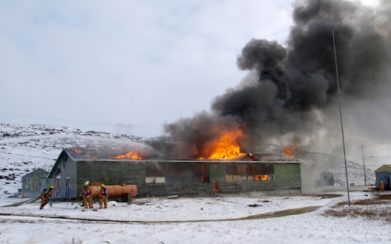 The old Sir Martin Frobisher federal day school in Apex burns and firefighters battle the blaze Oct. 4. Witnesses said the fire started around 10 a.m. So far, there are no reports of any injuries. (PHOTO BY CHRIS WINDEYER)