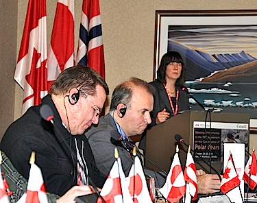 Virginia Poter, far right, the director of the Canadian Wildlife Service, shares the summary of this week’s international meeting on polar bear conservation in Iqaluit on Oct. 26, with members of the Canadian delegation to the left. (PHOTO BY SARAH ROGERS)