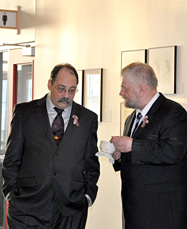 Tununiq MLA Joe Enook (left) with South Baffin MLA  Fred Schell at the fall sitting of the Nunavut legislature. Enook claims the Nunavut Housing Corp. is unfairly preventing him from taking a subsidized social housing unit in Pond Inlet. (PHOTO BY SARAH ROGERS)