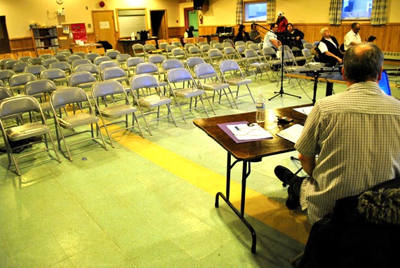 Playing to an empty house. At public hearing in Iqaluit, held the afternoon of Nov. 10 by the Utility Rates Review Council on a new rate plan from the Qulliq Energy Corp., only two or three Iqaluit residents showed up to listen and none spoke when invited to comment on the proposed new system. The QEC's plan wouldn't generate any extra money for the corporation, but would rebalance the Nunavut power rate system by having some communities, such as Iqaluit, pay up to five per cent more, while many other communities would pay up to four per cent less. Peter Mackey, the QEC's CEO, said Nunavut could be able to move gradually to a territorial-wide power rate system in about nine years. A second meeting was scheduled for 6:30 p.m., also at the parish hall. (PHOTO BY JIM BELL) 