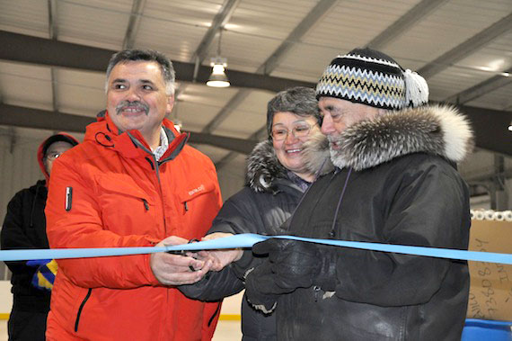 From left, Community and Government Services Minister Lorne Kusugak, Resolute Bay mayor Tabitha Mullin and the community’s former mayor, Ludy Pudluk, cut the ribbon at the grand opening of the community’s new arena Oct. 29. (PHOTO BY RON ELLIOTT)