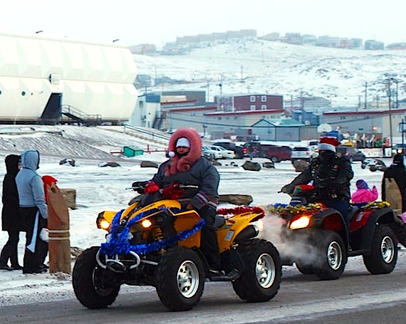 Who says Santa's elves ride on a sleigh? Here elves ride four-wheelers Dec. 10 in Iqaluit's annual Christmas parade. (PHOTO BY DEAN MORRISION)