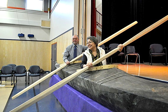 A kayak full of dreams: Nunavut Premier Eva Aariak and Hudson Bay MLA Alan Rumbolt at the official opening of Paatsaali High School in Sanikiluaq Dec. 1. Inuit in the eastern Hudson Bay area are known for their two-person kayaks, whose Inuktitut name inspired the choice of the new high school's name. (PHOTO COURTESY OF NUNAVUT GOVERNMENT)
