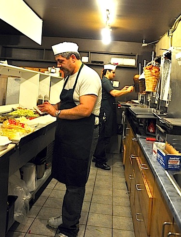 Hassan Abdul Ghani, left and Khldoun El-Shamaa man the shawarma spits at Yummy Shawarma, the latest addition to Iqaluit’s culinary landscape. (PHOTO BY SARAH ROGERS)