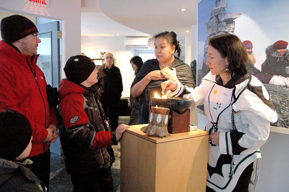 Annie Baron, centre and Lisa Koperqualuk, at right, talk to visitors at the Nunavik Information Centre during the opening of the Quebec Winter Carnival Jan. 28. The Makivik Corp.-run centre will serve up a taste of Nunavik culture at the famed Quebec City winter event, which runs until Feb.12. (PHOTO BY LUCIE FERLAND)