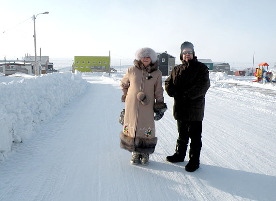 Nicole Ménard, Quebec's minister of tourism, left and Pierre Corbeil, minister of agriculture were in Nunavik and northern Quebec last week. The pair stopped in Umiujaq Jan.13, where they announced $300,000 for the community's new hotel (the yellow building in the background to the left.) The money flows from the province’s new assistance program aimed at developing tourism projects in northern Quebec under its Plan Nord. Umiujaq's new hotel will accomodate the visitors expected to come to the region once the nearby Tursujuq Park opens.  (PHOTO COURTESY OF QUEBEC'S DEPT. OF TOURISM)