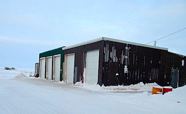 Louie Bruce, the owner of Sudliq Developments Ltd. in Coral Harbour, built this heated garage — the only one in the community — so that fuel delivery trucks could be kept warm and operate without problems in the winter. However, he lost the Government of Nunavut fuel contract in late 2011. (FILE PHOTO)