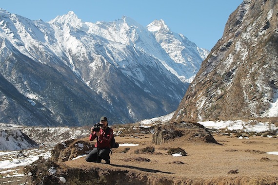 Mike Jaypoody films in the scenic Tsum Valley (PHOTO BY SHARI GEARHEARD)