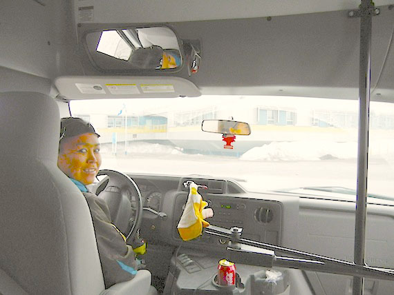 Syra Tukalak, who drives a 32-passenger bus around Puvirnituq, stops near the Inuulitsivik hospital. For $1 people can ride the bus around the community and hop off at one of many bus stops along the way. Tukalak took on about 100 passengers May 28 — but Monday is one of the quieter days of the week, she said. Thanks to money from Quebec, there are public transit projects in Puvirnituq and Inukjuak, although 11 other communities in Nunavik offer a combined transit service to elders and members of the public. (PHOTO BY JANE GEORGE)