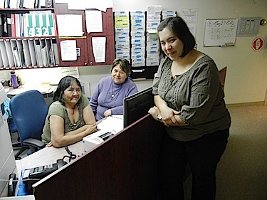 Jacinthe Boutin,  Jeannie Nappatuk and Veronique Tremblay talk at the reception area of the patient ward — referred to as the 