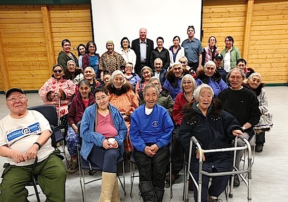 Youth, elders and residents in Cambridge Bay meet to show their support for naming their community arena the Nathan Ookpik Youth Memorial Arena Complex: Nathan Ookpik Taylor's parents Dave and Mona Taylor (back row third and fouth from the right), Cambridge Bay's mayor Jeannie Ehaloak (back row fifth from right), pastor and deputy mayor Keith Lear Sr. (back row sixth from right) along with community elders. Nathan Ookpik Taylor died in a motorcycle accident in Cambridge Bay on Sept. 13, 2011. The hamlet council members voted earlier this year to name the arena after Taylor