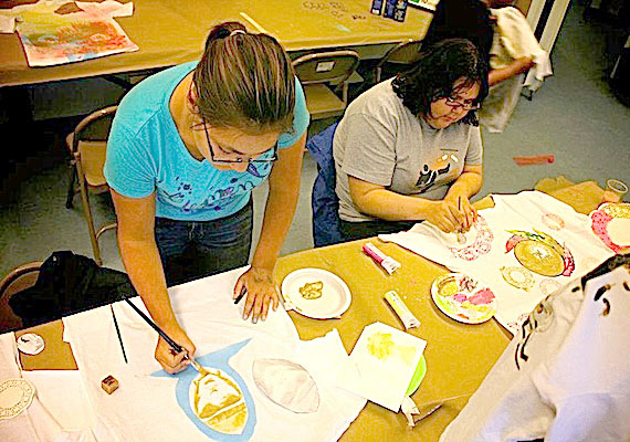 These Iqaluit girls try their hands at decorating tee-shirts May 3 at the Iqaluit Centennial Library during one of many National Youth Arts Week events going on this week in the city. The fun continues with a comic book illustration workshop May 4, from 5:30 p.m. to 9 p.m. at the library, followed by two movies (and popcorn,) at no charge. The creation of a giant mural is scheduled for May 5. Go to the Iqaluit youth arts week Facebook page at http://on.fb.me/JuhI2F for more information. (PHOTO BY PATRICK BELAND)