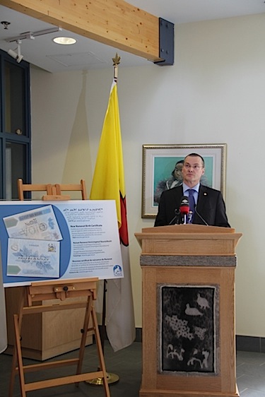 Nunavut's health minister unveils the territory's new birth certificate June 5 in Iqaluit at the Nunavut legislature. (PHOTO BY SAMANTHA DAWSON)
