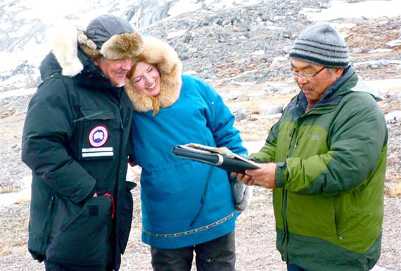 A romantic wedding on the tundra. Nataq Levi (right), a justice of the peace from Arctic Bay, conducts a wedding service for Dr. Lisa Ramshaw (centre), a psychiatrist from Toronto who has visited Arctic Bay twice a year for more than a decade, and David Miller, a Toronto architect. The couple married at a popular fishing lake about 100 to 150 kilometres south of Arctic Bay during the annual Victoria Day fishing derby. Arctic Bay mayor Frank May presented the couple with Arctic Bay toques made by the Qimatuligvik Heritage Centre. (PHOTO COURTESY OF GAIL REDPATH)