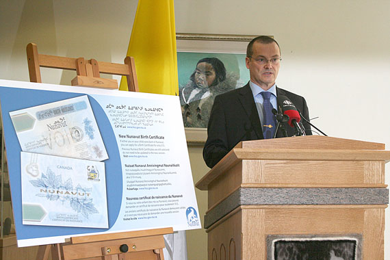 Health and Social Services Minister Keith Peterson unveils the new Nunavut birth certificate at the Legislative Assembly June 5. The certificates are ready to go as of today, and have security features to help protect against identify theft, not unlike the new $100 and $50 dollar bills. They are printed on polymer paper with a clear transparent window. 