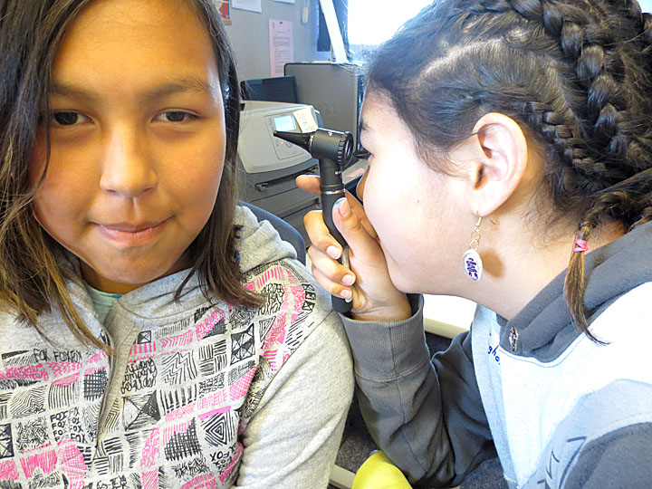 Teghan Angulalik learns how to properly use an otoscope to examine the ears of her mock patient, Pamela Emingak, after exploring the anatomy of the inner ear during the Actua in the North health career camp in Cambridge Bay. The Actua in the North health career camps are supported by the Department of Health and Social Services, and designed to promote health science careers and healthy living to Inuit youth. The goal is to introduce the kids to careers they may not be aware of in the health care and science fields. It “empowers them to maybe one day pursue something in that field,” youth instructor Juan Ruiz said, adding “We try to have a good balance between fun and science.” The camp is running in Rankin Inlet from July 23 to July 27, and in Iqaluit July 30 to August 3 at Arctic College. (PHOTO COURTESY OF ACTUA) 