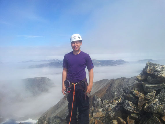 Josie Nulukie-Mesher, 19, stands at the summit of Mount D'Iberville. He and Tommy Jr. Adams, 16, are among 10 Nunavik youth cadets for the Kativik Regional Police Force who hiked through Kuururjuaq provincial park — called parc national Kuururjuaq by the Quebec government — between June 25 and July 1. (PHOTO COURTESY OF ATTITUDE MONTAGNE)