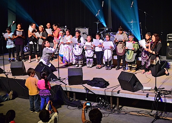 Evie Mark (juggling with rocks) and Akinisie Sivuarapik (right) perform the Illukitaarutik or juggling song with the group of young girls who participated in the workshop the two throat singers gave during the week of the recent Aqpik Jam music festival in Kuujjuaq. Read more about the success of the workshops at the music festival in a special feature story on Nunatsiaqonline.ca. (PHOTO BY ISABELLE DUBOIS)