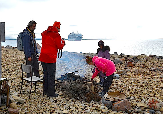 Eva Otokiak and Mary Avalak boil tea Aug. 30 for passengers from The World during their shore visit to Cambridge Bay. Read more about The World and its plans to transit the Northwest Passage on Nunatsiaqonline.ca. (PHOTO BY PAUL BELLOWES/ KITIKMEOT HERITAGE SOCIETY)