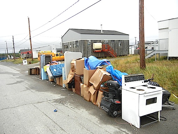A forlorn line of a belongings, including beds, children's toys and kitchen appliances, sits by the side of the road in Kuujjuaq Sept. 9 after the eviction of a family from their social housing unit due to unpaid rent. Faced with mounting arrears in the region — roughly $1.2 million in unpaid rent during 2011, Kativik Municipal Housing Bureau has started evicting some tenants who don’t pay rent. (PHOTO BY JANE GEORGE)