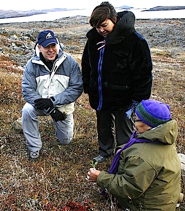 Alacie Joamie speaks with Prince Albert II and Qikiqtani Inuit Association president Okalik Eegeesiak Sept. 20 about the plants in Apex's Rotary Park. (PHOTO BY DAVID MURPHY) 