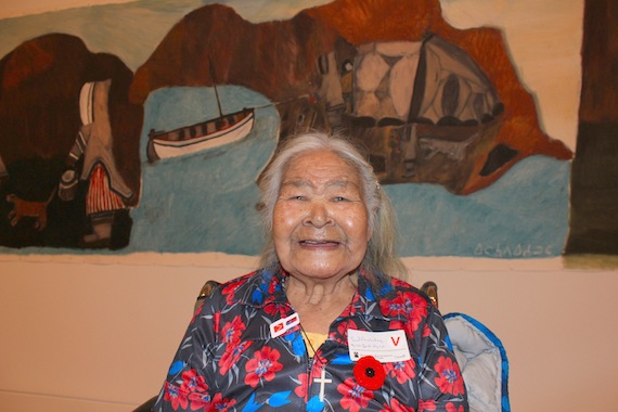 Elisapee Ishulutaq of Pangnirtung poses in front of her nine-metre long oil-stick-on-paper art piece entitled Nunagah (My Home Place) which now hangs in the National Gallery of Canada in Ottawa as part of the Canadian Biennial 2012 exhibition. The Biennial features a sampling of the gallery's recent contemporary acquisitions and also includes two works by Cape Dorset printmaker and graphic artist Qavavau Manumie. At 88, Ishulutaq was the eldest of 45 artists included in this year's Biennial. Read more about the Oct. 31 exhibition opening later on Nunatsiaqonline.ca. (PHOTO BY LISA GREGOIRE)
