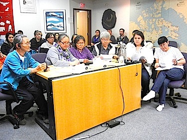 Women representing the five communities in Nunavut's Kitikmeot region speak Oct. 4 to delegates at the Kitikmeot Inuit Association annual general meeting in Cambridge Bay. (PHOTO BY JANE GEORGE)