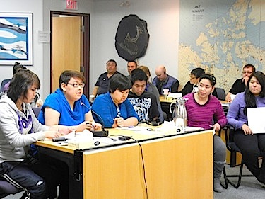 Tetra Otokiak, second from left, speaks to the Kitikmeot Inuit Association's annual general meeting in Cambridge Bay on Oct. 4 with other youth delegates. (PHOTO BY JANE GEORGE)
